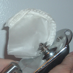 clean manual can opener with wax paper